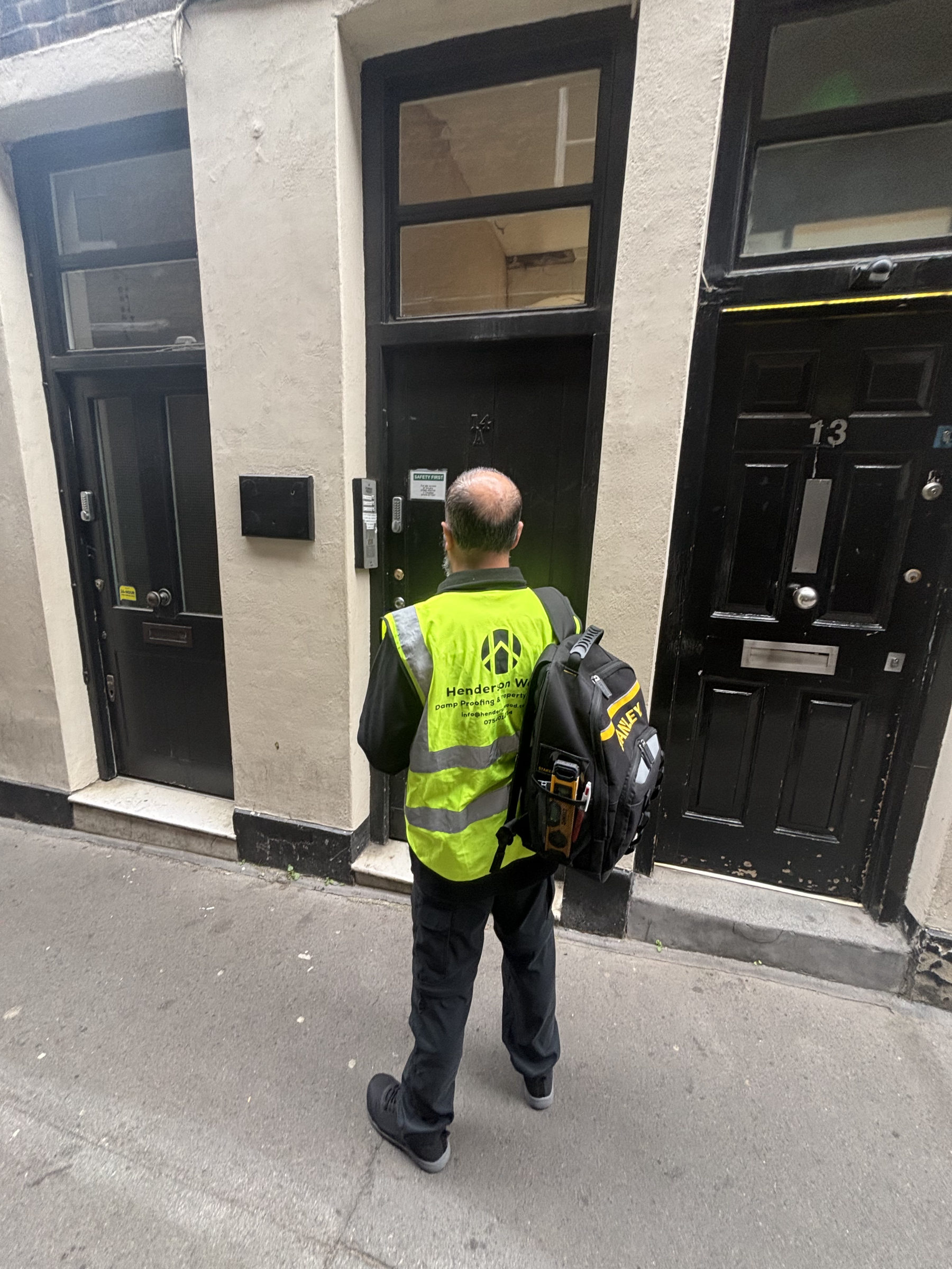 Henderson Wood surveyor arriving at a London property for a pre-purchase survey